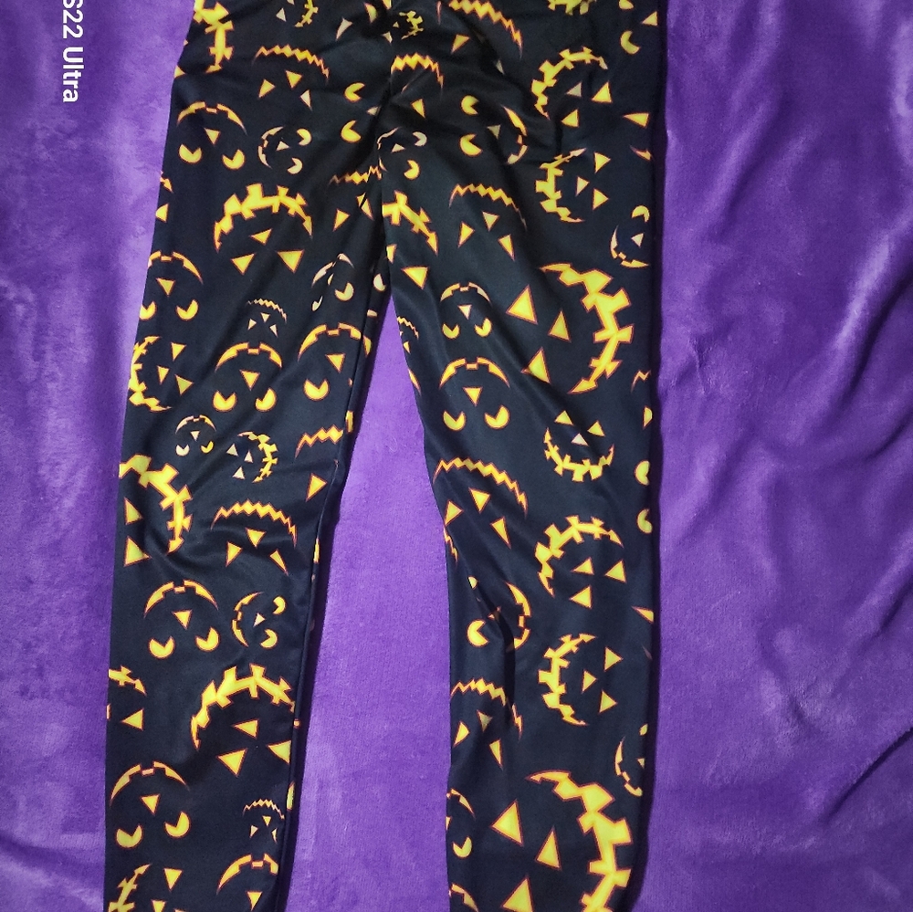Shiny Leggings with Pumpkin 🎃 graphics.  Polyester & Spandex for added comfort